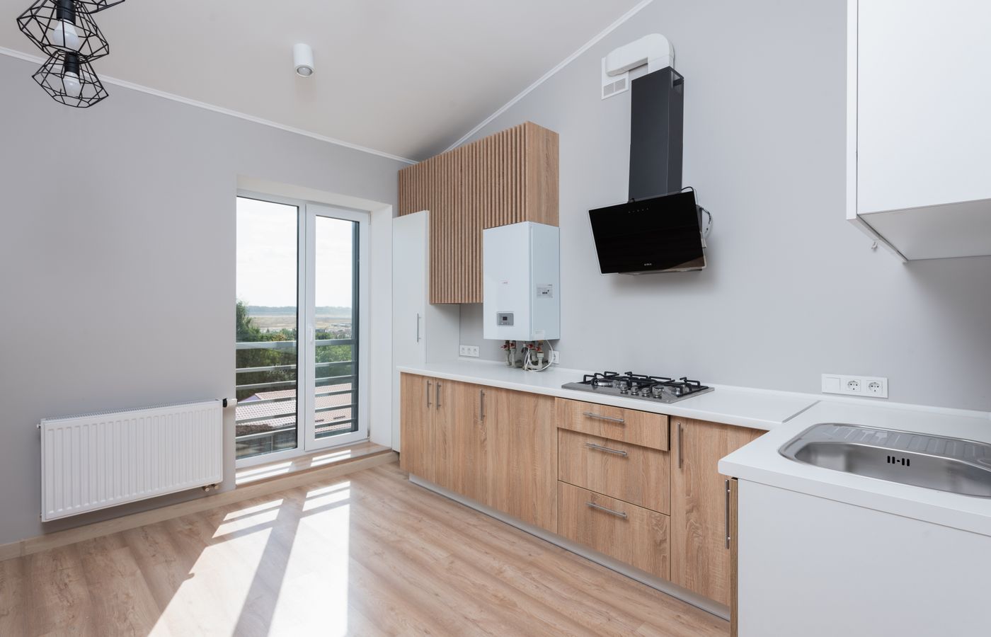Bright contemporary kitchen with stainless appliances — Amana repair technicians near you