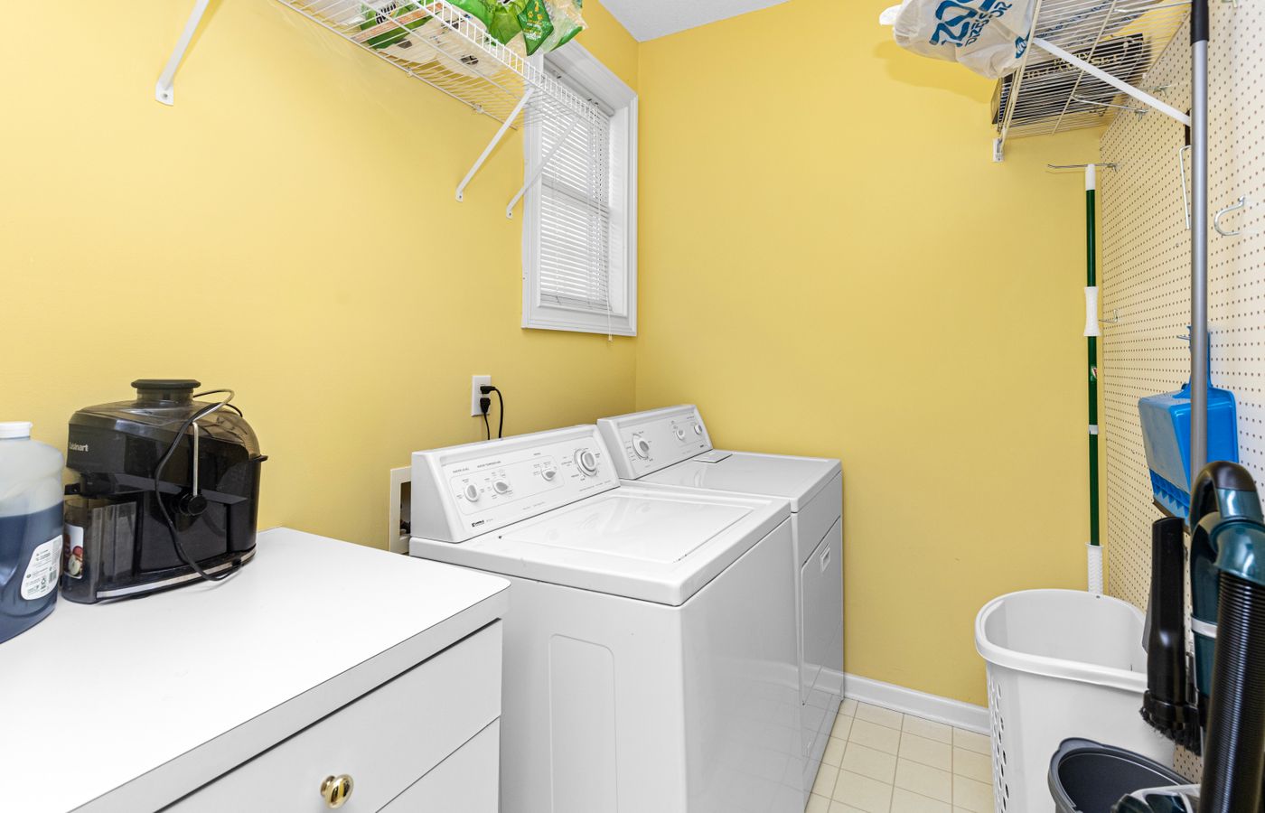 A bright laundry room with modern appliances — Amana repair specialists