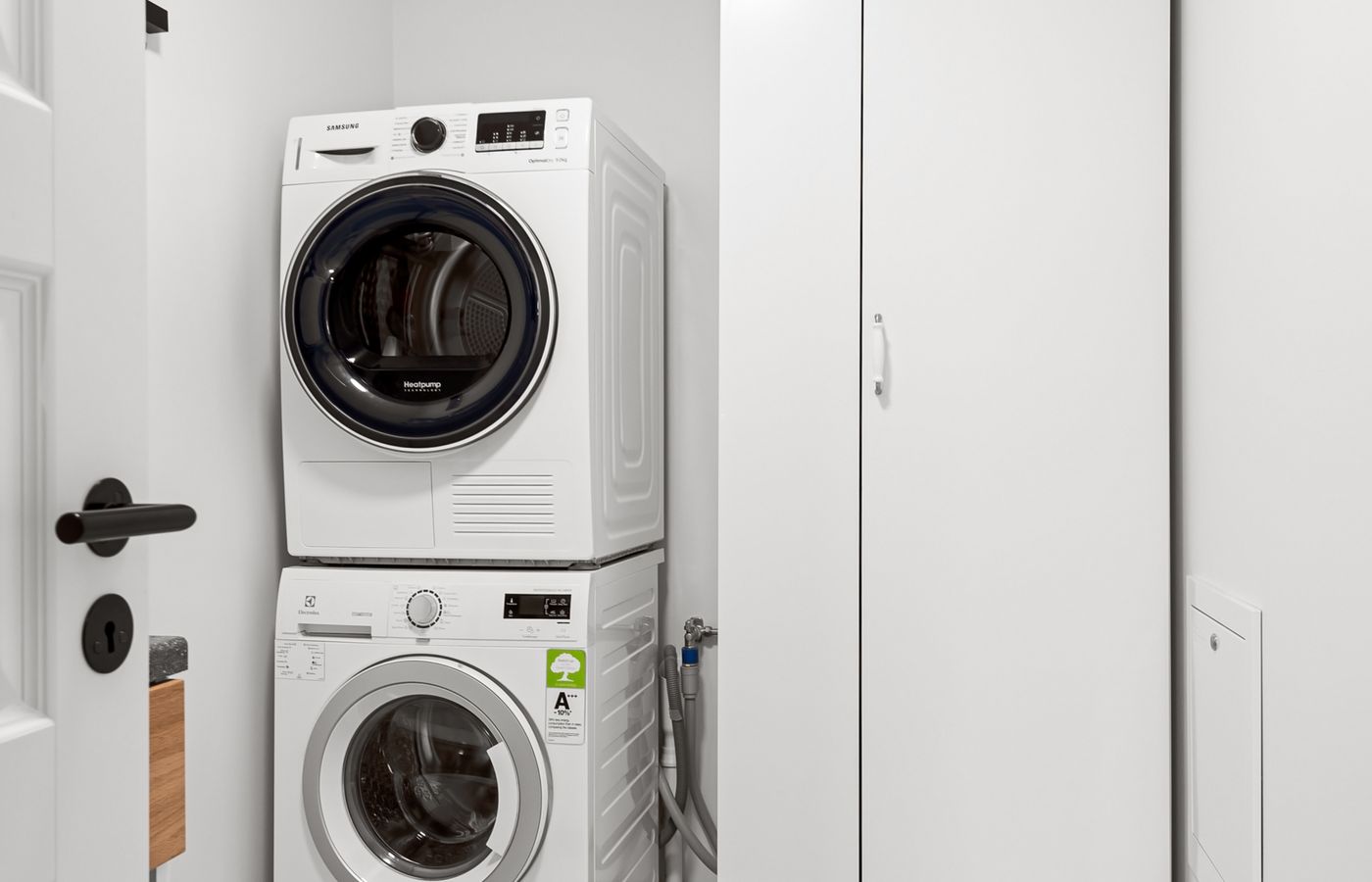 A home laundry room with a washer and dryer — local Amana appliance repair
